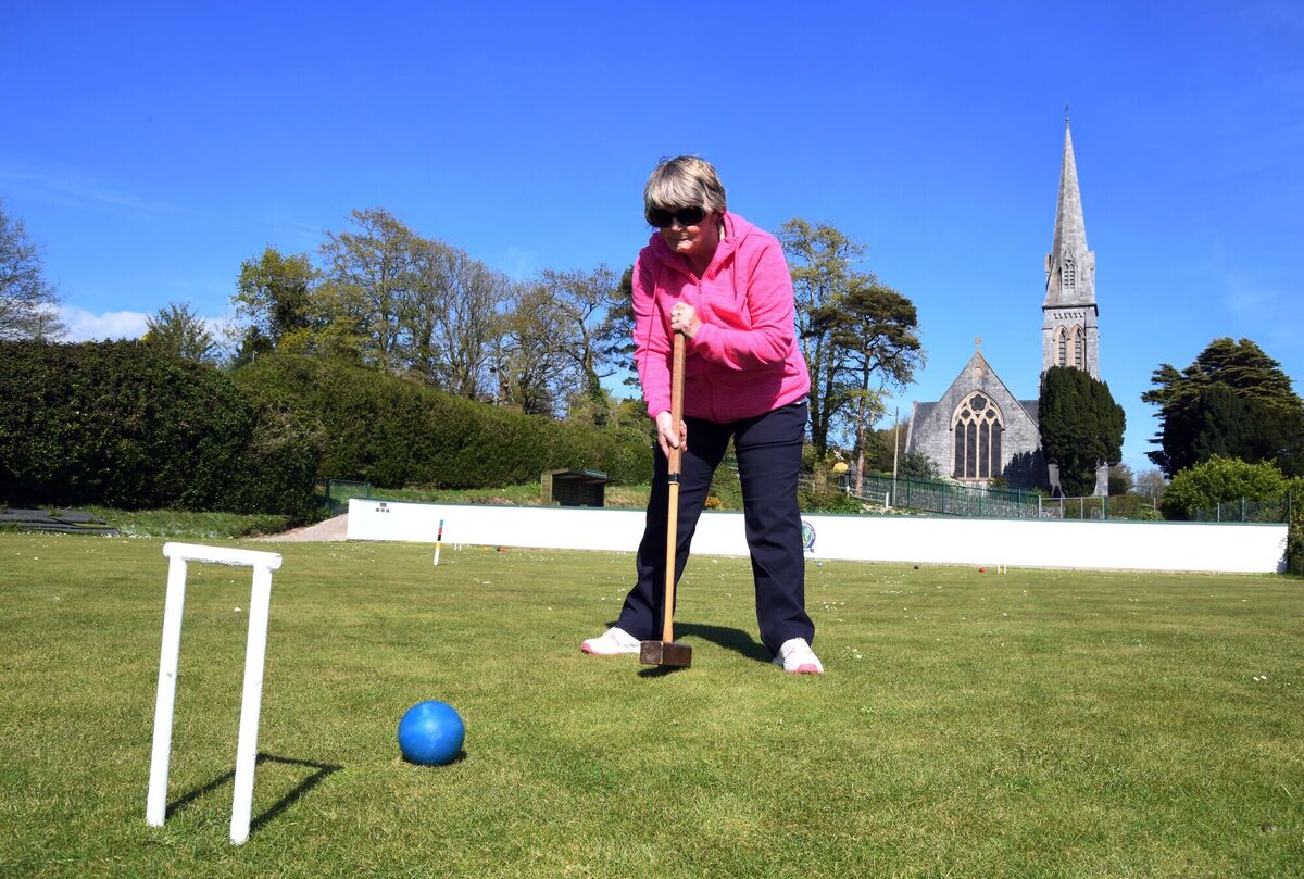 Through the hoops. Ann Whitty playing croquet at Rushbrooke Lawn Tennis &amp; Croquet Club.