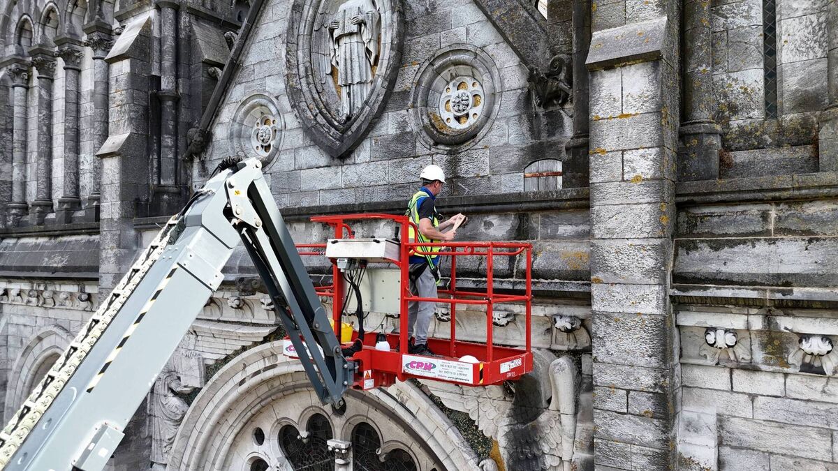 Michael Byrne performing pointing work to St Fin Barre's. Such interventions, while hidden from public view, will help protect the building for decades. Picture: Larry Cummins