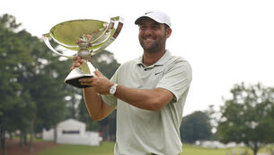 <p>Scottie Scheffler poses with the FedExCup Trophy after the final round of the Tour Championship golf tournament, Sunday, Sept. 1, 2024, in Atlanta. (AP Photo/Jason Allen)</p>