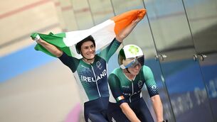 <p>Katie George Dunlevy, left, and pilot Eve McCrystal of Ireland celebrate after winning silver in the women's 3000m individual pursuit final on day four of the Paris 2024 Paralympic Games. Photo by Ramsey Cardy/Sportsfile</p>