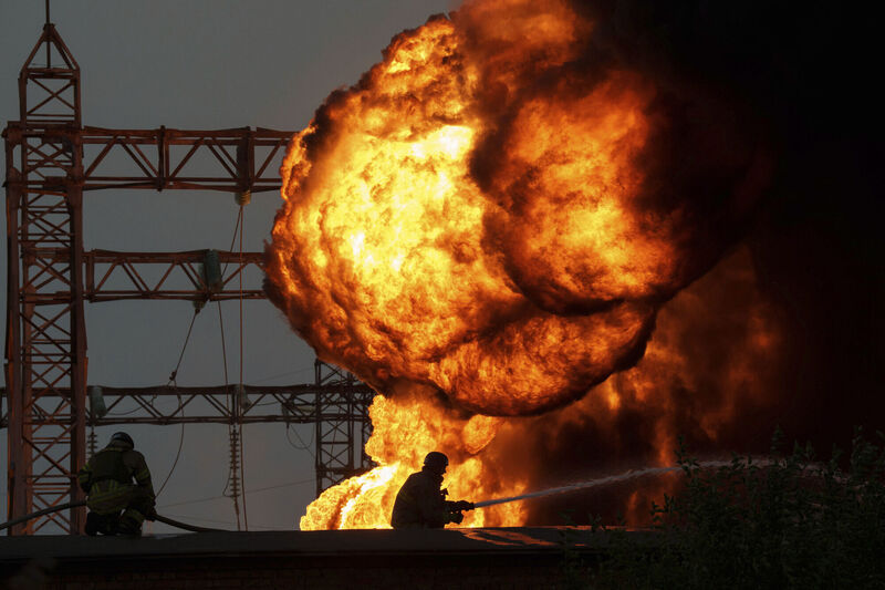 Rescue workers extinguish a burning electrical substation hit by a Russian bombing in Dnipropetrovsk region, Ukraine, on Monday. Photo: AP/Evgeniy Maloletka Rescue workers extinguish a burning electrical substation hit by a Russian bombing in Dnipropetrovsk region, Ukraine, on Monday. Photo: AP/Evgeniy Maloletka