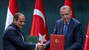 Turkish President Recep Tayyip Erdogan, right, shakes hands with Egyptian President Abdel Fattah el-Sissi during a bilateral signature agreements ceremony at the Presidential palace in Ankara on Wednesday (Francisco Seco/AP)