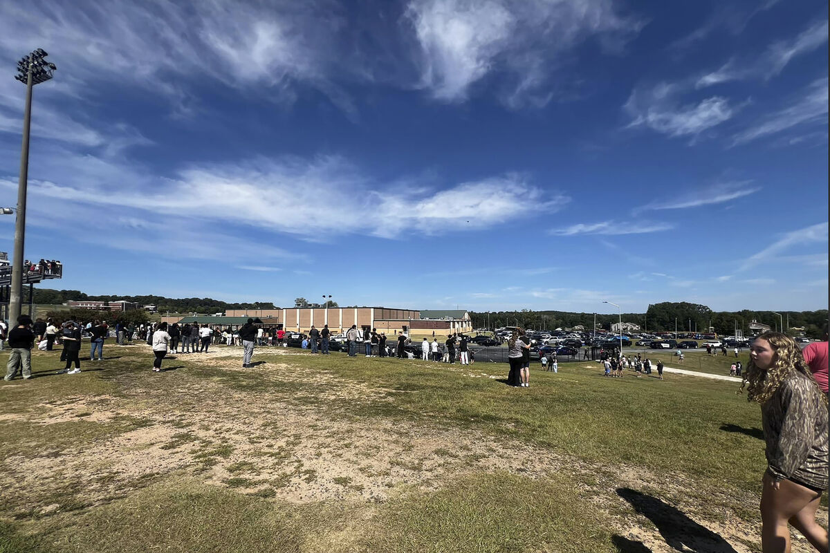 Students are evacuated to the football stadium after the school campus was placed on lockdown at Apalachee High School in Winder, Ga., on Wednesday, Sept. 4, 2024. (Erin Clark via AP) Students are evacuated to the football stadium after the school campus was placed on lockdown at Apalachee High School in Winder, Ga., on Wednesday, Sept. 4, 2024. (Erin Clark via AP)