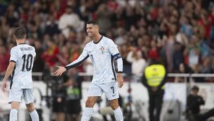 <p>Portugal's Cristiano Ronaldo celebrates with Portugal's midfielder #10 Bernardo Silva after scoring his team's second goal during the UEFA Nations League group A football match between Portugal and Croatia (Photo by PATRICIA DE MELO MOREIRA/AFP via Getty Images)</p>