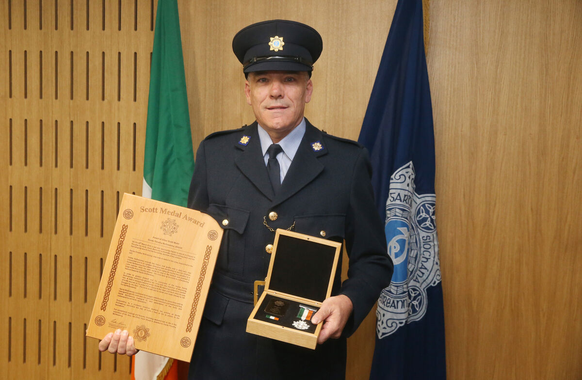 Garda Timothy McSweeney with his medal. Picture: Stephen Collins /Collins Photos