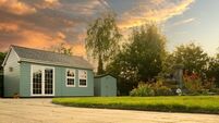 Wonderful, summer view of a newly installed wooden summer house and cabin.