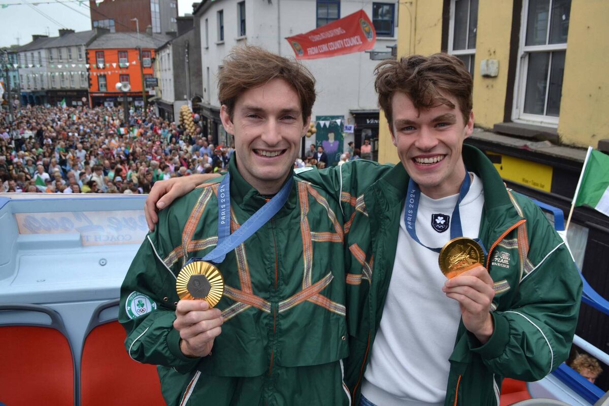 Olympic gold medalist rowers Paul O'Donovan, left and Fintan McCarthy during the open top bus parade as Skibbereen welcomed home its Olympic heroes. Photo; Anne Minihane. Olympic gold medalist rowers Paul O'Donovan, left and Fintan McCarthy during the open top bus parade as Skibbereen welcomed home its Olympic heroes. Photo; Anne Minihane.