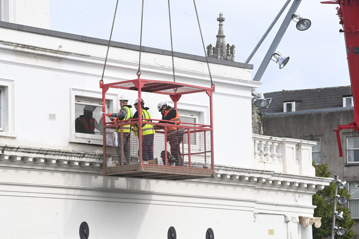 Workers in their 'man crate' during the clean-up operation. Workers in their 'man crate' during the clean-up operation.