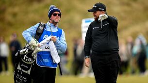 <p>Shane Lowry in coversation with caddy Darren Reynolds on the 9th fairway during day two of the Amgen Irish Open at the Royal County Down Golf Club. Picture: Ramsey Cardy/Sportsfile</p>