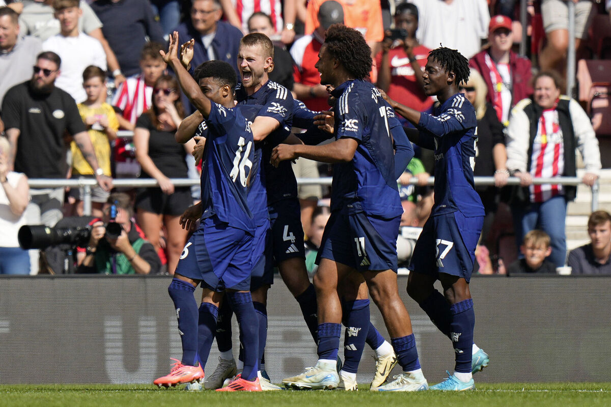 Matthijs de Ligt, center, celebrates after scoring his first goal for Manchester United
