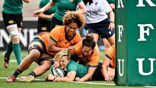<p>Aoife Dalton scores her side's first try despite the tackle of Faitala Moleka</p>
