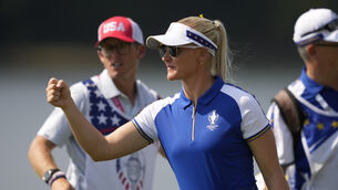Europe’s Charley Hull celebrates after winning her Saturday foursomes with Esther Henseleit on day two of the Solheim Cup (Matt York/AP)
