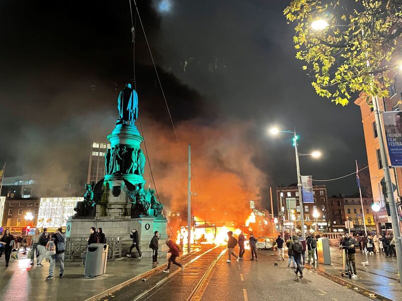 Vehicles on fire on O'Connell St in Dublin after violent scenes unfolded last November following the knife attack on Parnell Square East where five people were injured. Picture: Brian Lawless/PA