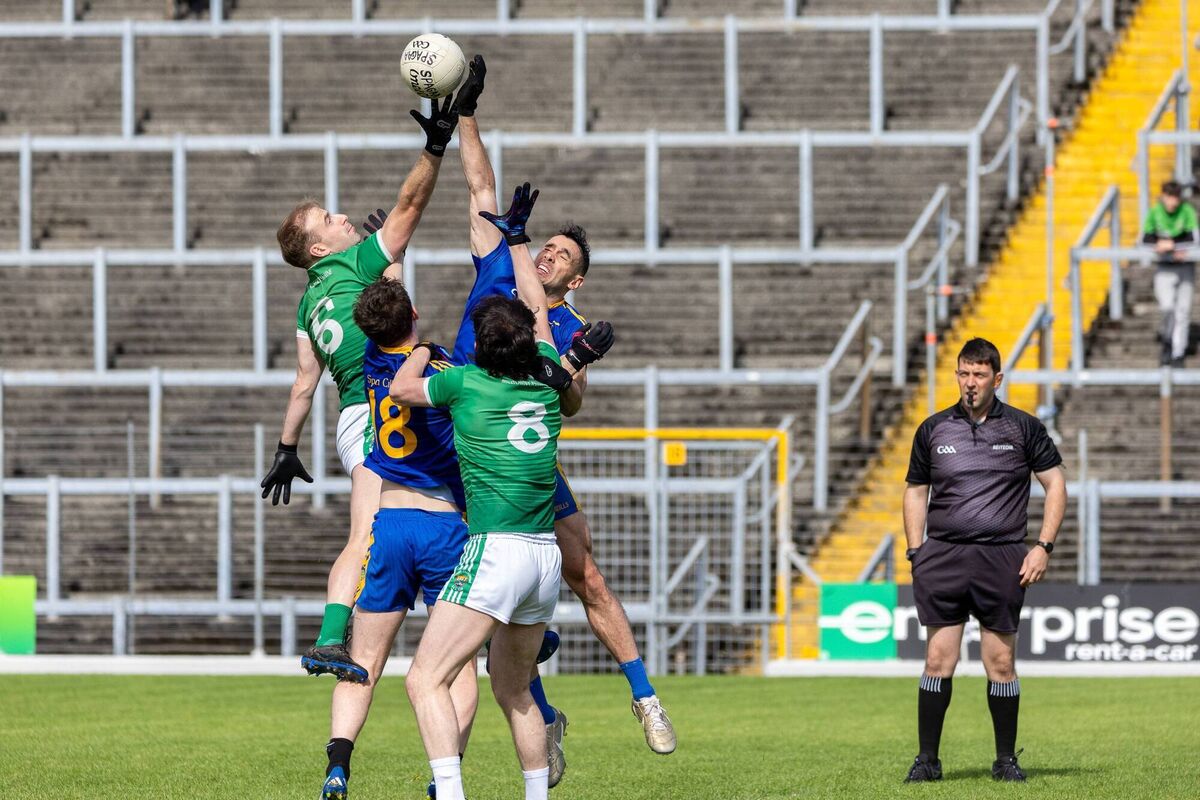 Michael Foley and Oran O'Neill of Spa in action against David Roche and Donal Dennehy of Milltown/Castlemaine Michael Foley and Oran O'Neill of Spa in action against David Roche and Donal Dennehy of Milltown/Castlemaine