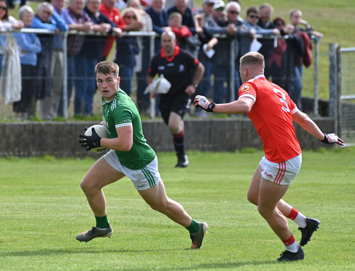 Fionn Herlihy of Doheny's has his path blocked by Darren Daly. Fionn Herlihy of Doheny's has his path blocked by Darren Daly.