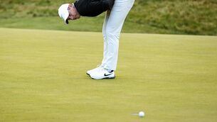 <p>SO CLOSE: Rory McIlroy reacts after missing an eagle chance to force a play off on the 18th at the Amgen Iris Open.</p>