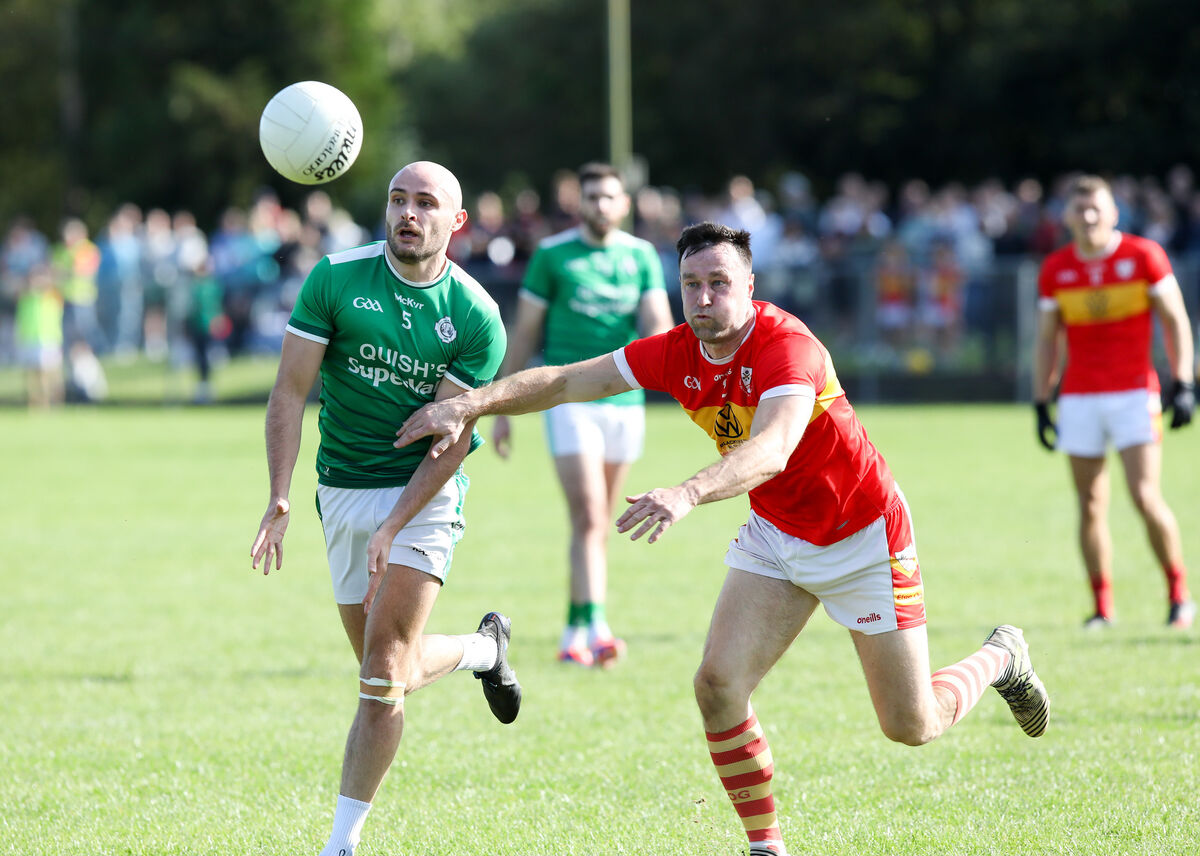 Ballincollig's Frank Down and Éiré Óg's Dermot Herlihy chase the ball during a Cork PSFC game in Kilmurry Co. Cork. Picture: David Creedon