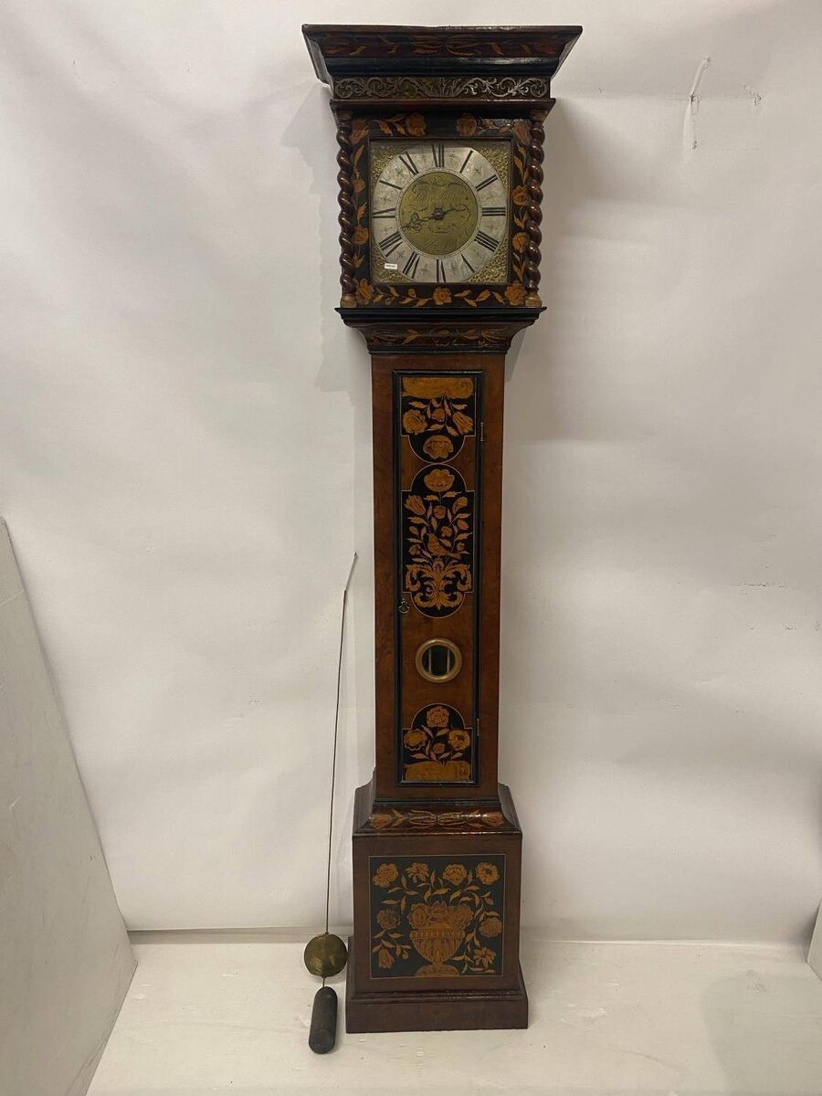 An English c1690 walnut and marquetry inlaid longcase clock at Lynes and Lynes.