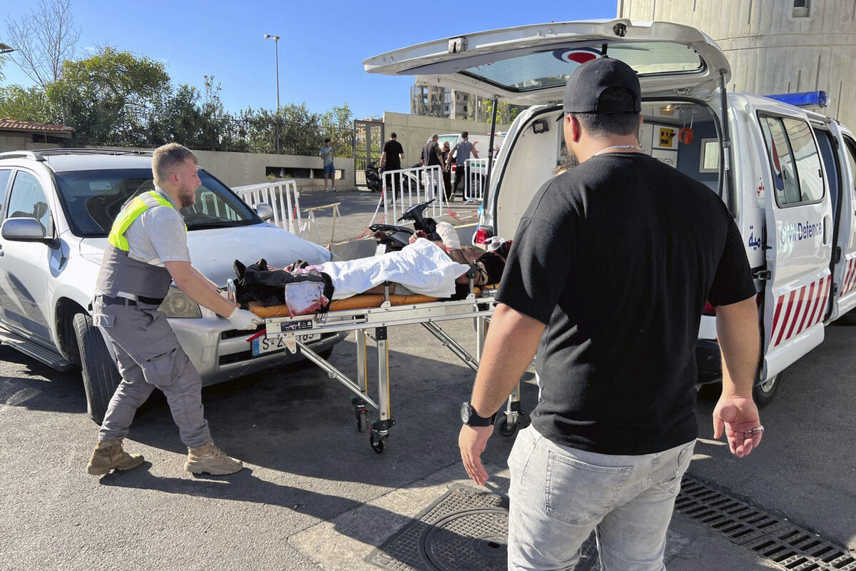 Civil Defense first-responders carry a wounded man whose handheld pager exploded at al-Zahraa hospital in Beirut, Lebanon, Tuesday, Sept. 17, 2024. Picture: AP Photo/Hussein Malla