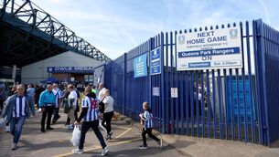 <p>Fans arrive at the ground ahead of a match at Hillsborough, Sheffield. Pic: Gary Oakley/PA Wire.</p>