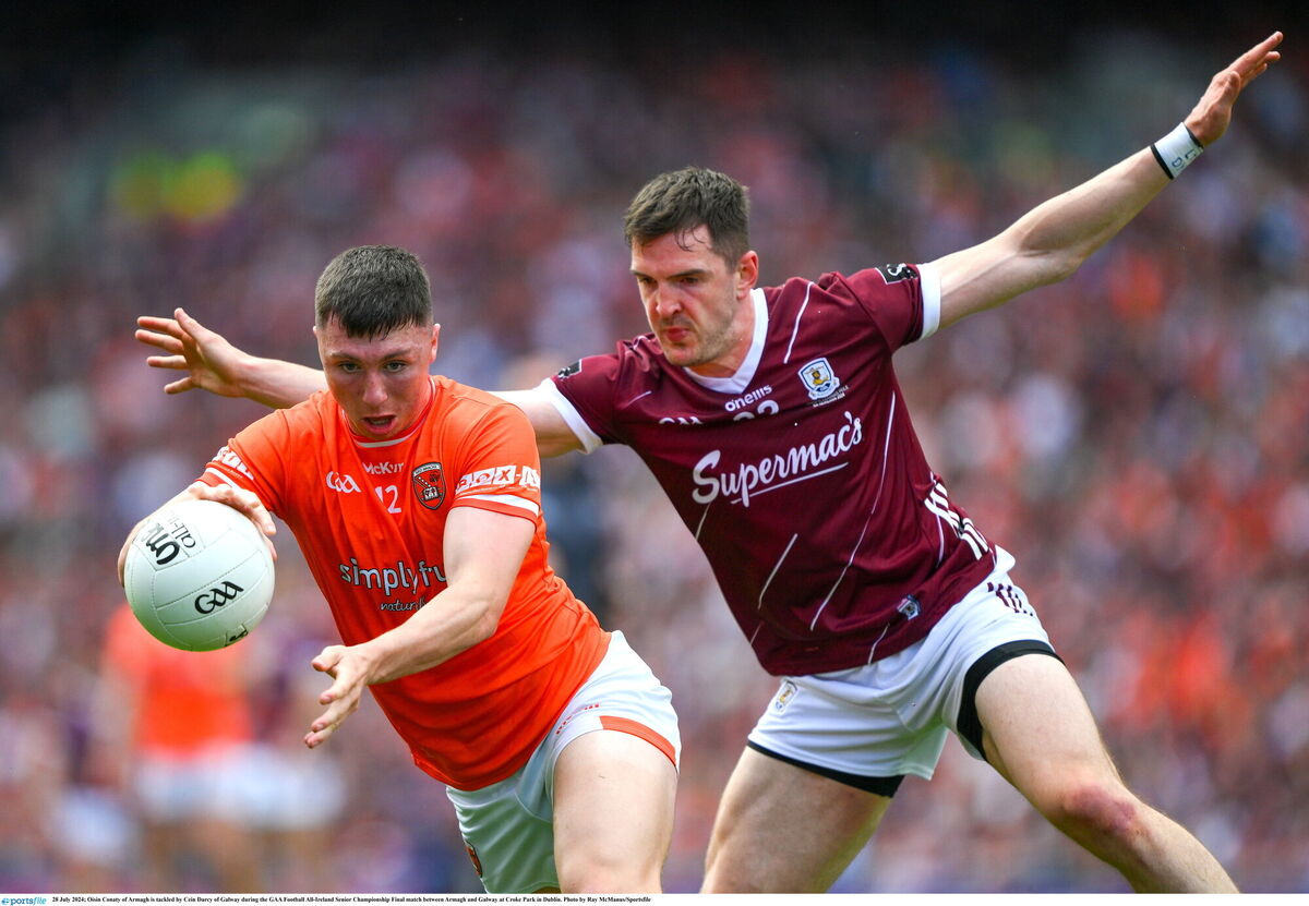 Young Footballer of the Year nominee Oisín Conaty of Armagh is tackled by Céin D'arcy of Galway. Photo by Ray McManus/Sportsfile