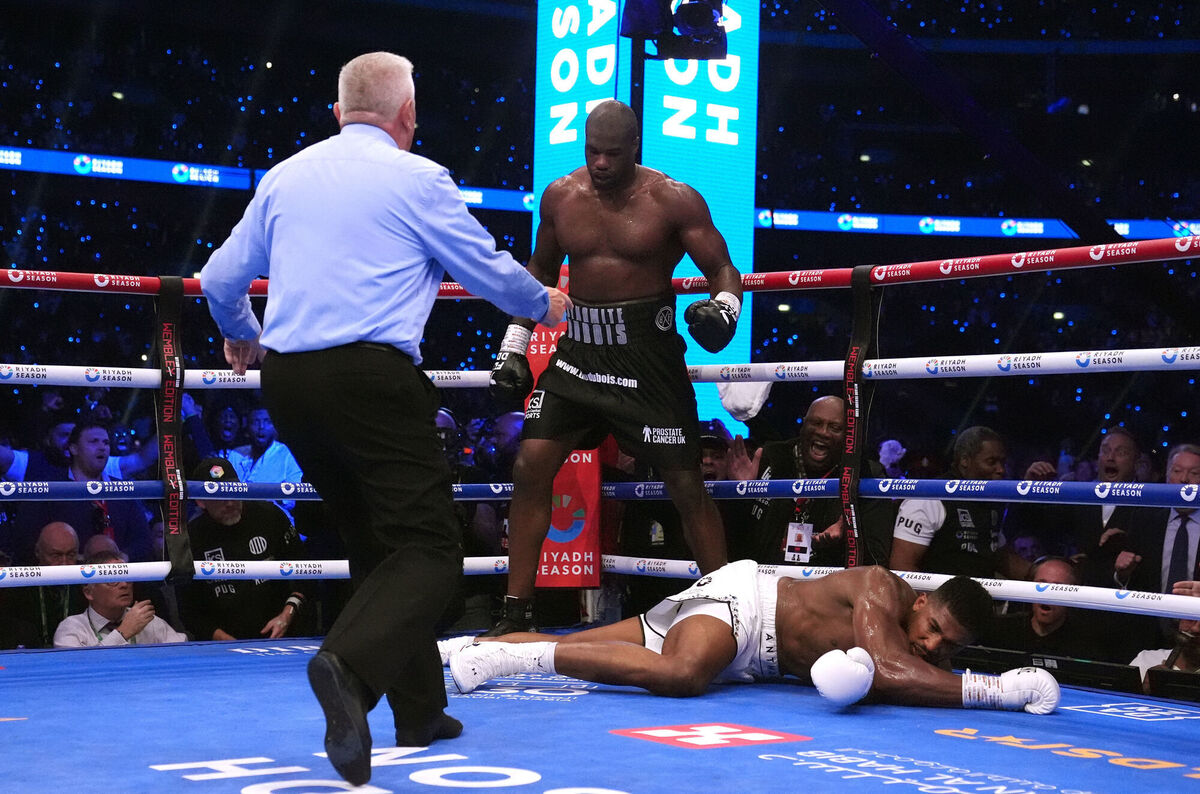 Anthony Joshua being knocked down by Daniel Dubois in the IBF World Heavy weight bout at Wembley Stadium. Pic: Bradley Collyer/PA Wire.