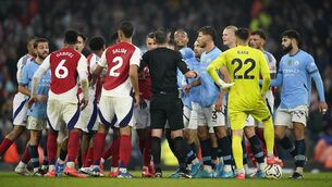 <p>RED HOT: Players clash toward the end of the Premier League match between Manchester City and Arsenal. Picture: AP Photo/Dave Thompson</p>