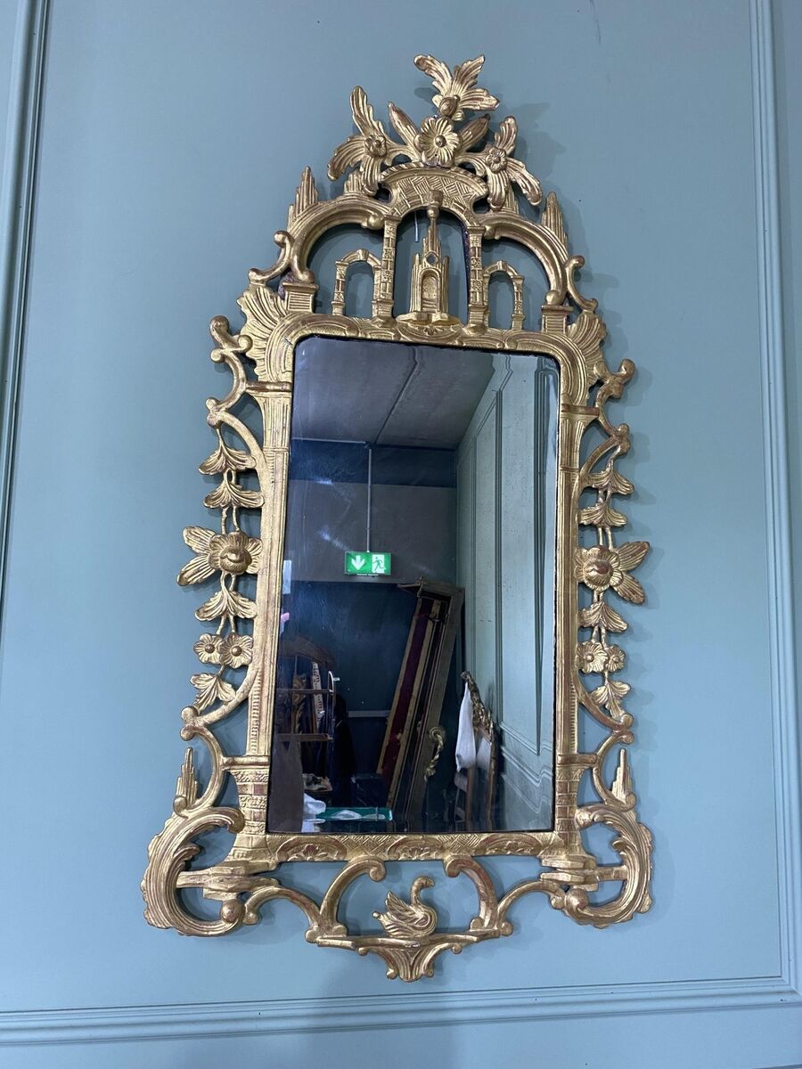 An Irish 18th-century carved giltwood pier mirror.