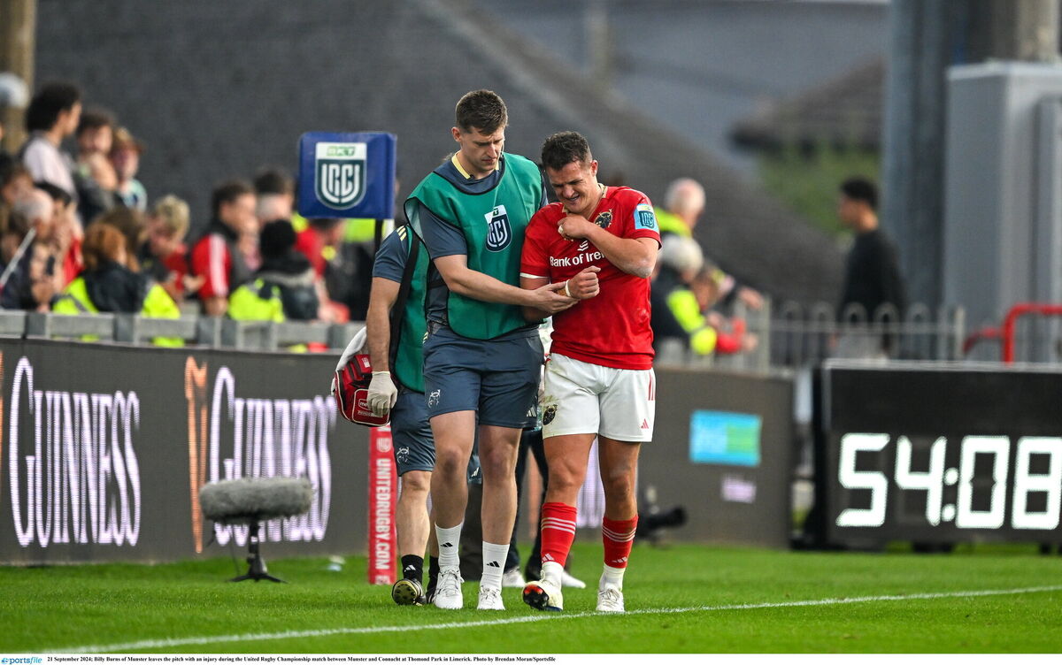 Billy Burns of Munster leaves the pitch with an injury during the URC match against Connacht. Picture: Brendan Moran/Sportsfile