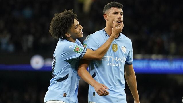 <p>LITTLE LAHM: Manchester City's Rico Lewis forces a smile on Manchester City's Matheus Nunes after he scored against Watford. Pic: AP Photo/Dave Thompson.</p>