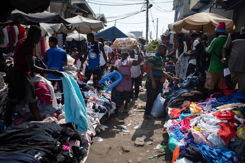 Traders and buyers looking at secondhand clothes at the Kantamanto market in Accra, Ghana.