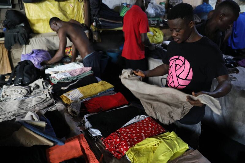 Workers package secondhand clothes for sale at the Kantamanto Market in Accra, Ghana. Picture: Nipah Dennis/AFP via Getty Images