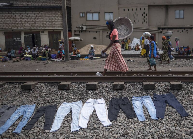 Second-hand jeans laid out on the ground to dry after starching ahead of resale at the Kantamanto textile market in Accra, Ghana. Picture: Andrew Caballero-Reynolds/Bloomberg via Getty Images