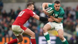<p>BIGGAR MAN: Wales' Dan Biggar and Ireland's James Hume in action. Pic: Niall Carson/PA Wire.</p>