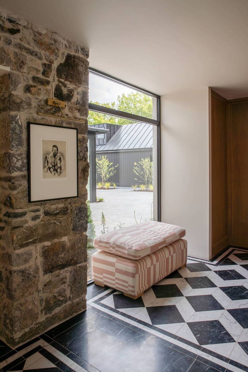 The ottoman in the hallway, covered in Pierre Frey fabric. The ottoman in the hallway, covered in Pierre Frey fabric.