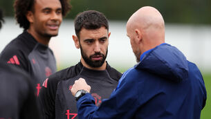 <p>Manchester United manager Erik ten Hag with Bruno Fernandes during a training session earlier this week. Pic: Martin Rickett/PA</p>