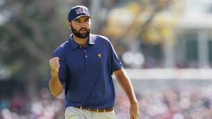 <p>BACK IN CONTROL: Scottie Scheffler of the U.S. Team celebrates on the 17th green. Picture: Harry How/Getty Images)</p>