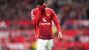 <p>KEY MOMENT: Manchester United's Bruno Fernandes walks after being shown a red card. Pic: Martin Rickett/PA Wire.</p>