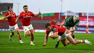 <p>Shane Daly of Munster scores his side's fourth try despite the tackle of Mack Hansen of Connacht during the URC match at Thomond Park. Photo by Brendan Moran/Sportsfile</p>