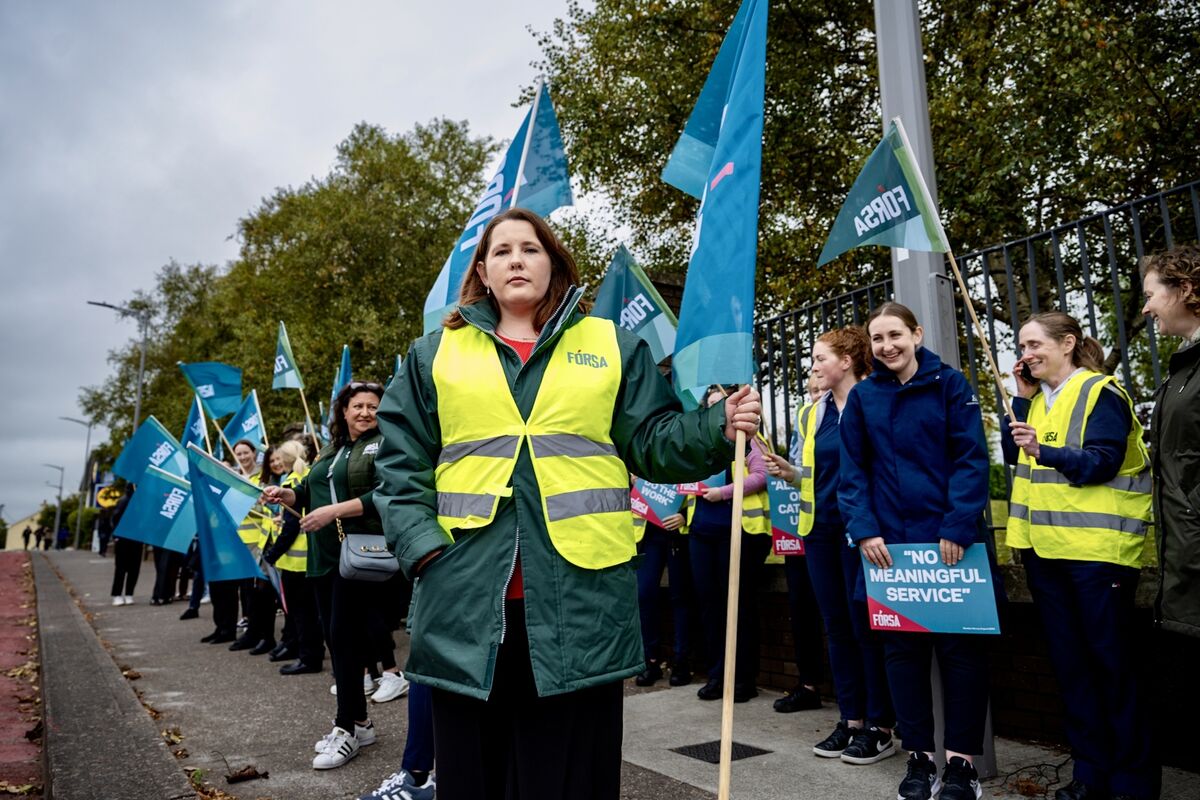 Fórsa member Linda Kelly joins the protest on Thursday outside CUH. Picture: Chani Anderson