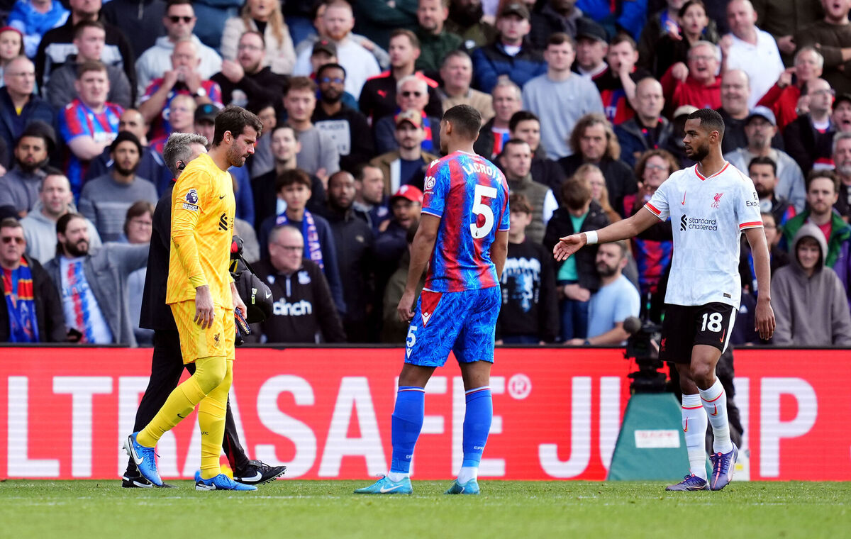 Liverpool goalkeeper Alisson Becker leaves the pitch with an injury during the Premier League match at Selhurst Park. Pic: Adam Davy/PA Wire. Liverpool goalkeeper Alisson Becker leaves the pitch with an injury during the Premier League match at Selhurst Park. Pic: Adam Davy/PA Wire.