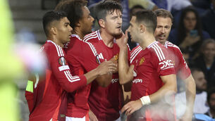 <p>Manchester United's Harry Maguire, centre, celebrates after scoring his side's third goal against Porto. Pic: AP Photo/Luis Vieira</p>