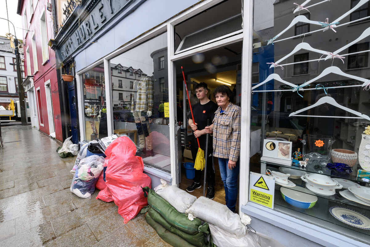  Joey O'Driscoll and Regina O'Mahony cleaning up after the flooding at the Second Hand Shop in Bantry, West Cork. Picture: Dan Linehan
