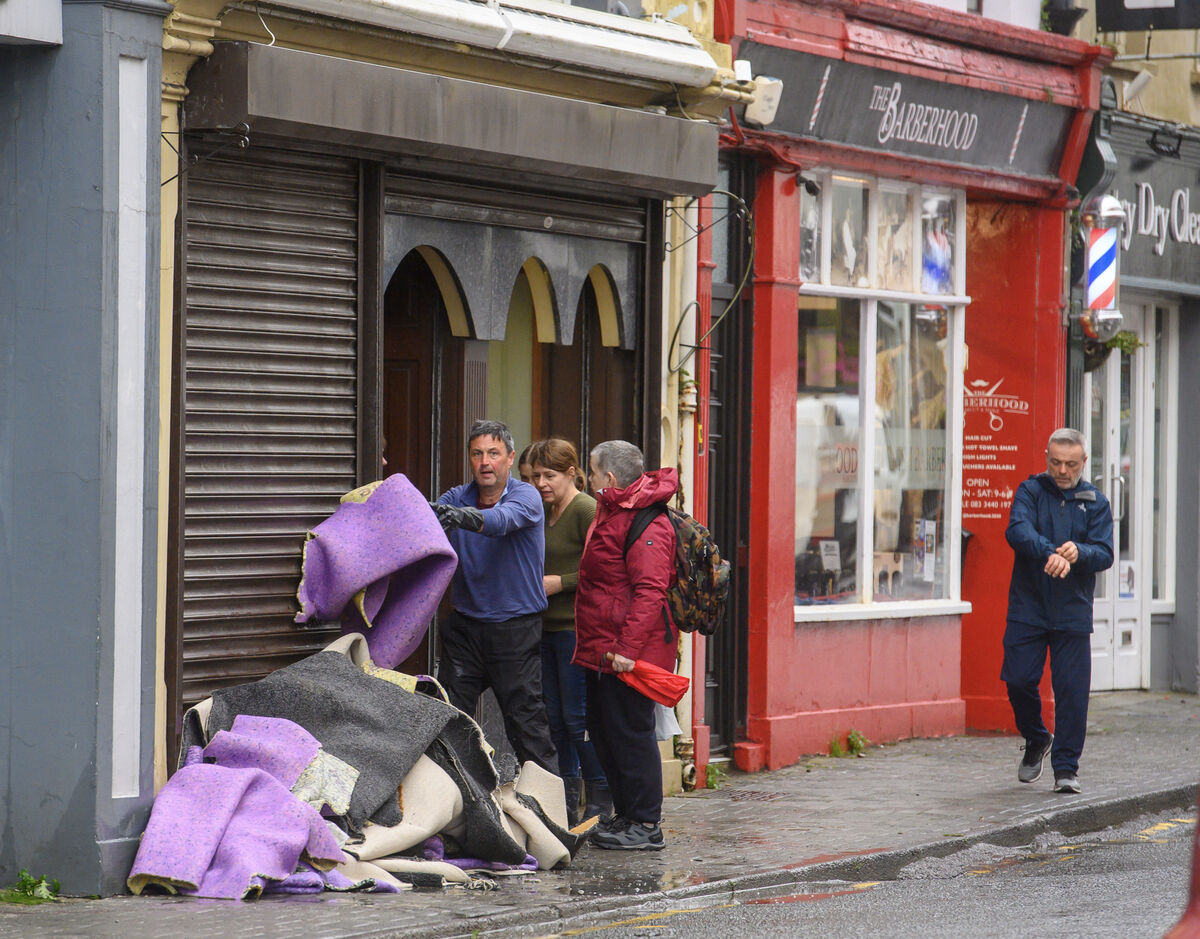 Tony McElhinney removing carpets from Philip J Dix & Co after the flooding on New Street. Picture Dan Linehan Tony McElhinney removing carpets from Philip J Dix & Co after the flooding on New Street. Picture Dan Linehan