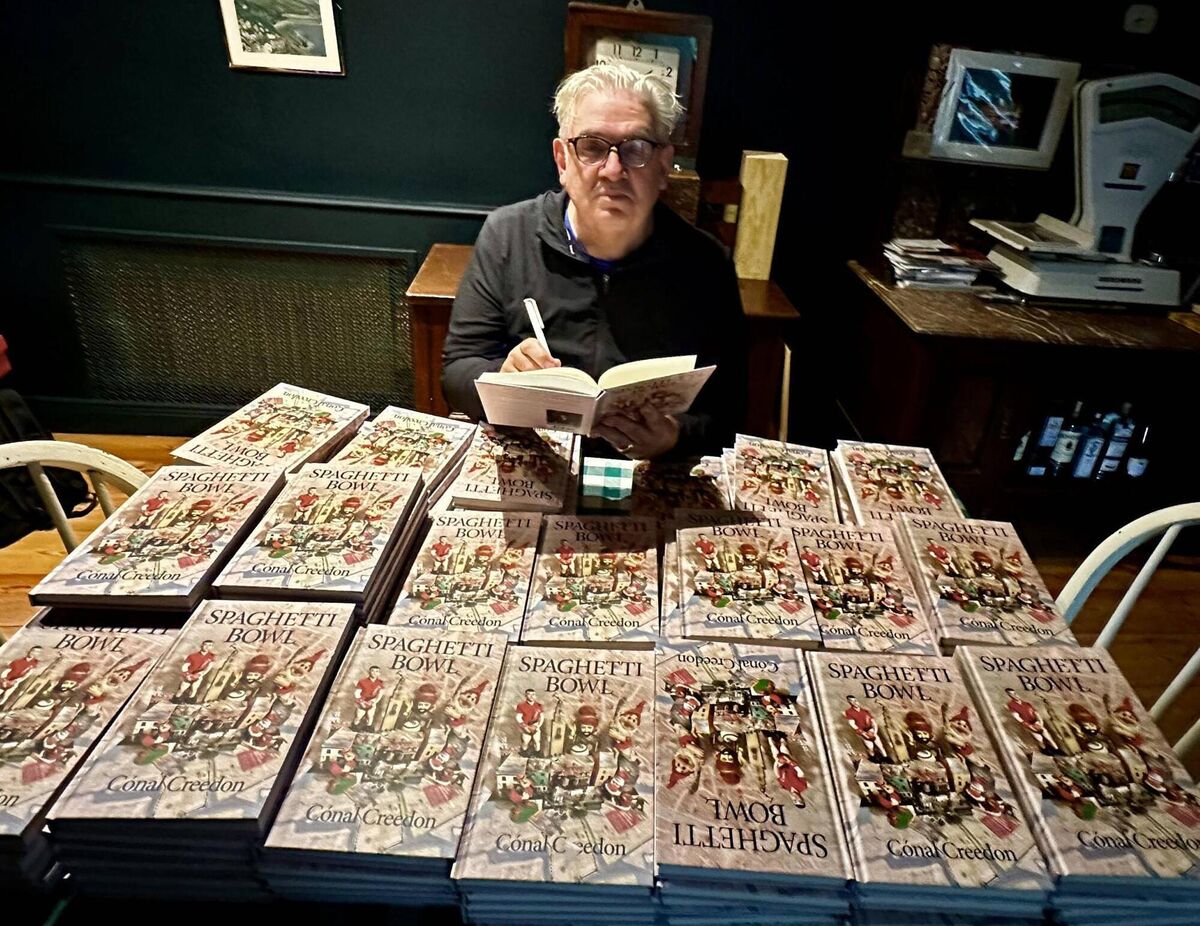  Cónal Creedon signing copies of Spaghetti Bowl. 