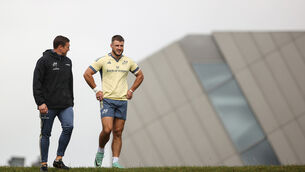 <p>Academy coach Tommy O’Donnell arrives for training with Alex Nankivell. Pic: INPHO/Ben Brady</p>