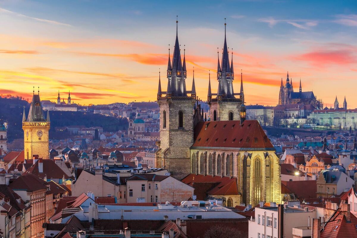 Church of Our Lady before Tyn, Old Town and Prague Castle at sunset in Prague, Czech Republic,