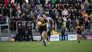 <p> FLYING: Dr Crokes' Gavin White is chased down by St Brendan's Tom Hoare in Saturday's Kerry SFC semi-final at Austin Stack Park. Pic: Domnick Walsh.</p>