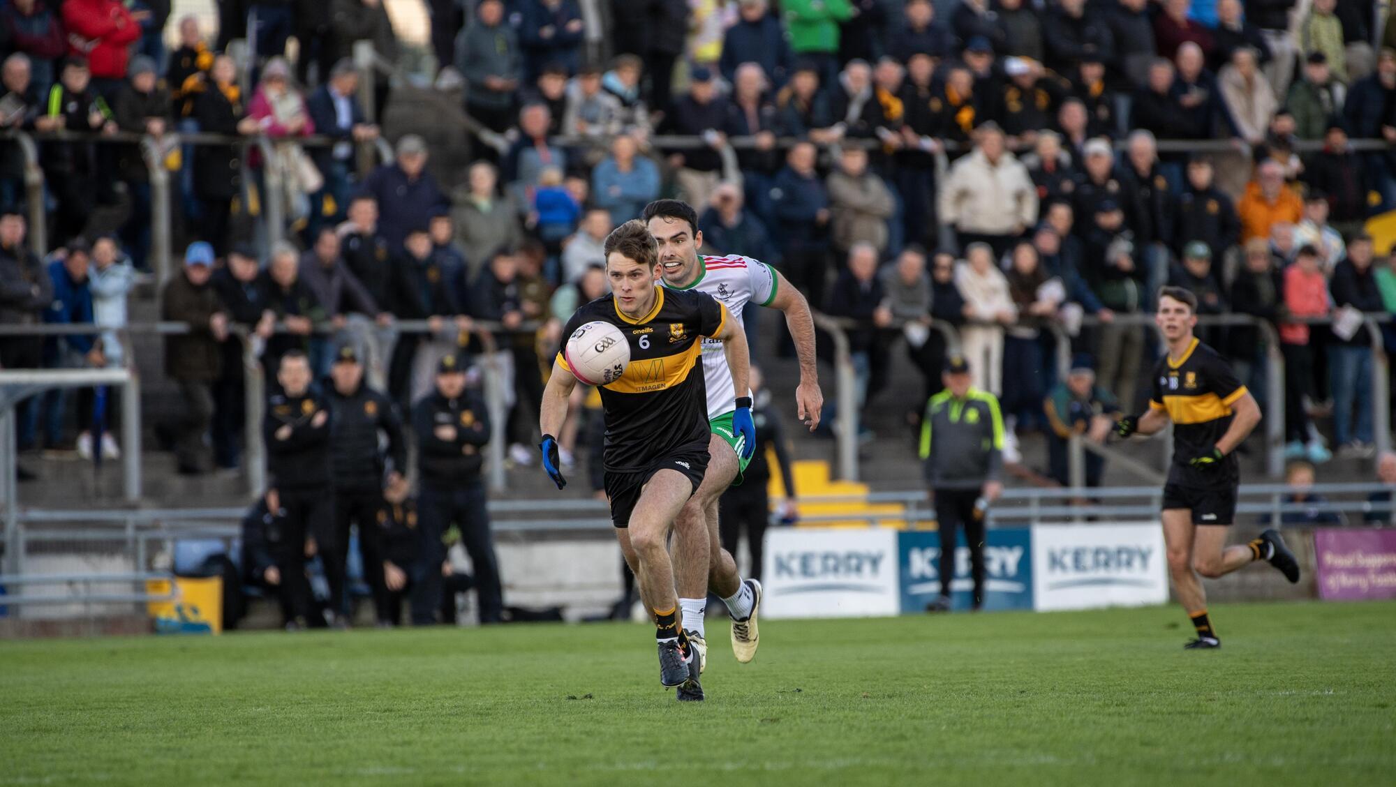  FLYING: Dr Crokes' Gavin White is chased down by St Brendan's Tom Hoare in Saturday's Kerry SFC semi-final at Austin Stack Park. Pic: Domnick Walsh.