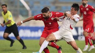 <p>Lebanon's Hilal El-Helwe vies for the ball with North Korea's defender Sim Hyon-jin. Picture: AFP via Getty Images</p>